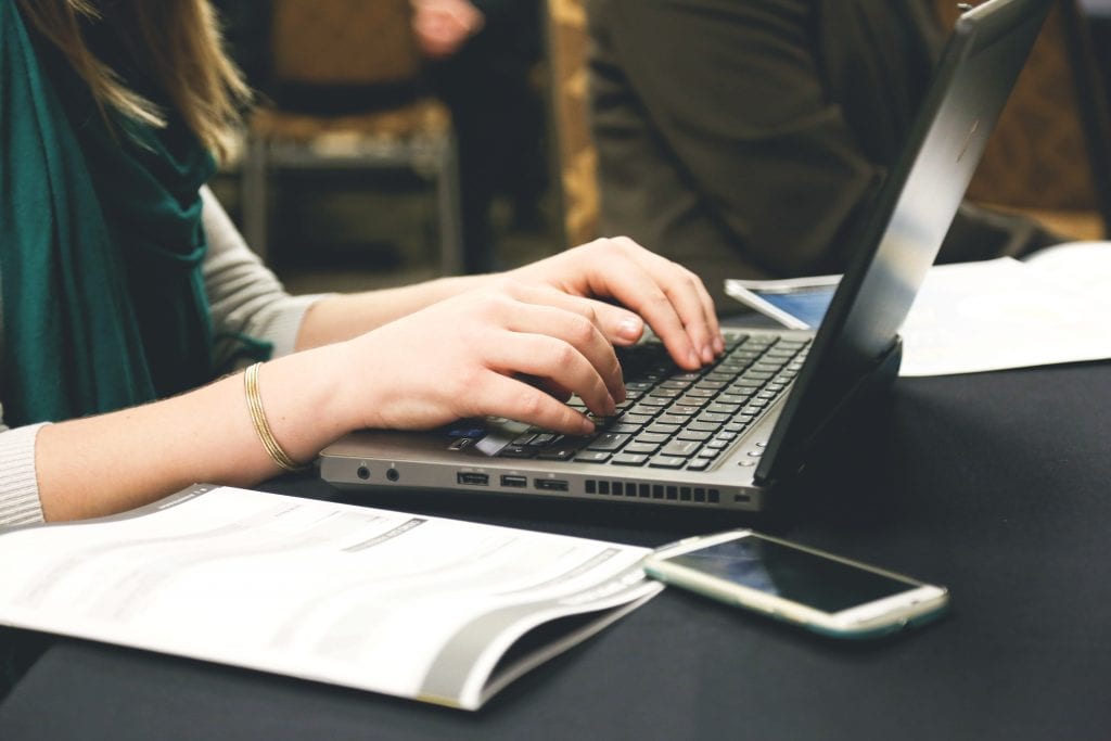 Woman typing on keyboard