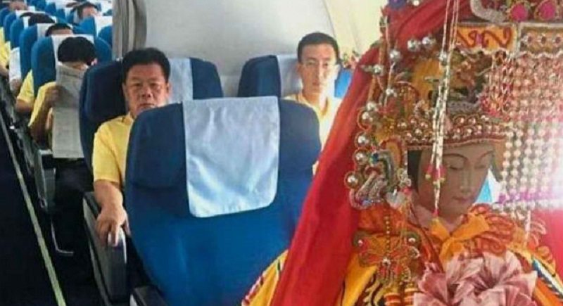 Chinese God Statues Flying in Business Class Puzzle Travelers