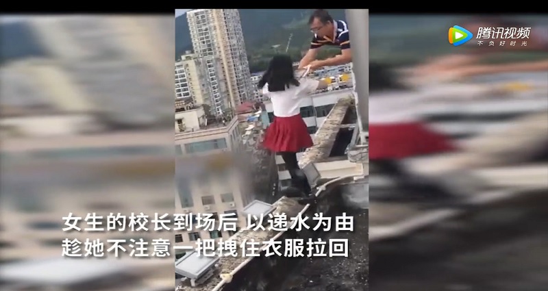 Chinese Principal Saves Suicidal Girl by Grabbing Her Shirt Before She Jumps 17 Stories
