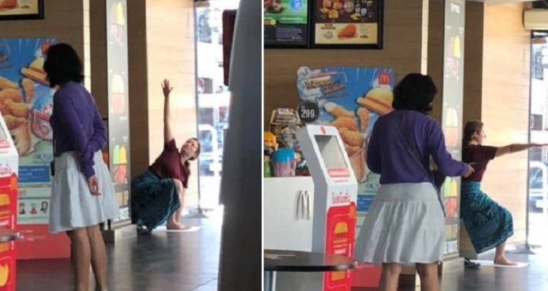 Foreign Woman Does Impromptu Yoga Session Inside a McDonald’s in Thailand