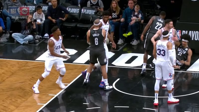 An Asian man who swiftly took his son away from a courtside ruckus is being hailed as “Dad of the Year” on social media.