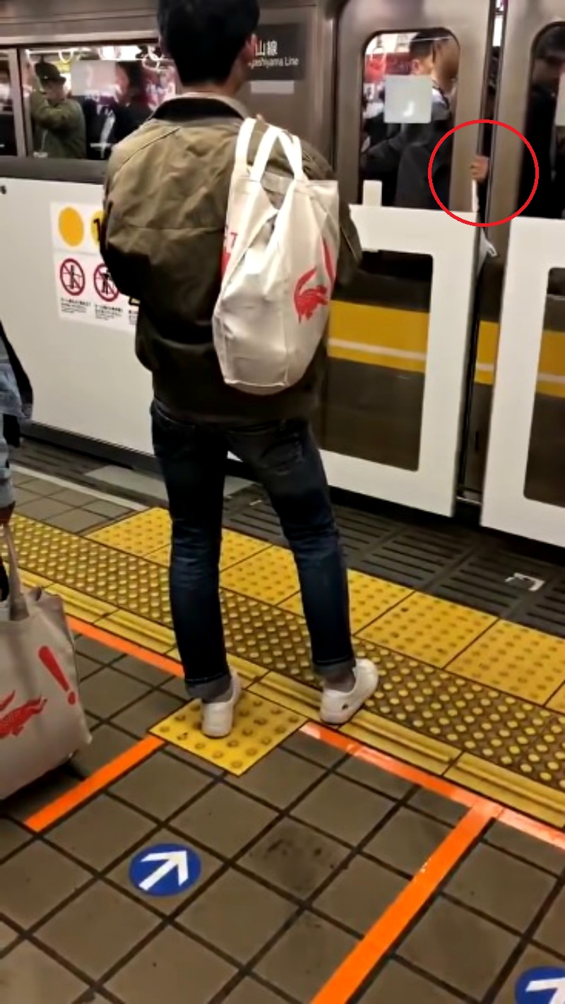 An elderly Japanese commuter who managed to stop a train has gone viral on social media.