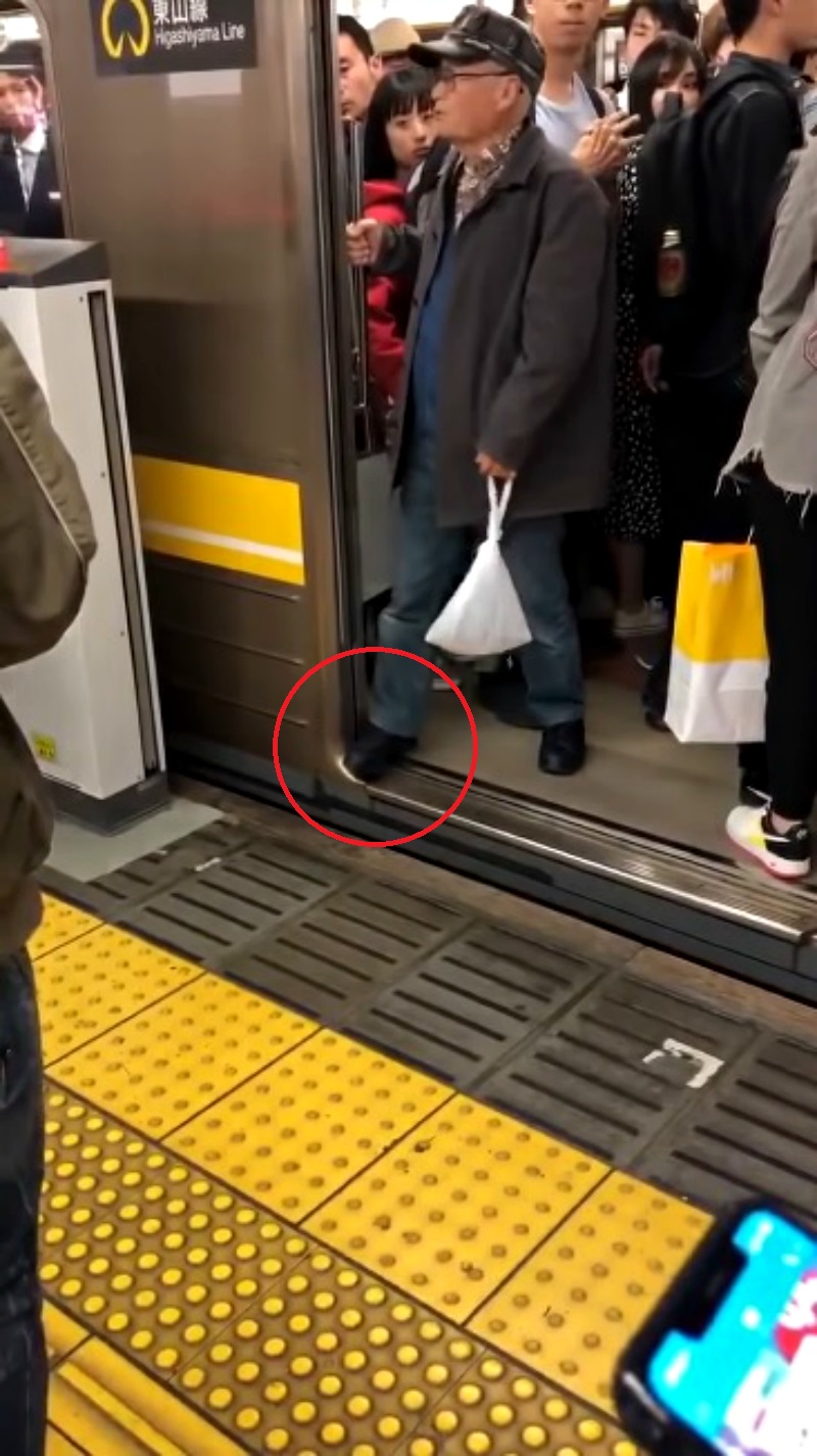 An elderly Japanese commuter who managed to stop a train has gone viral on social media.