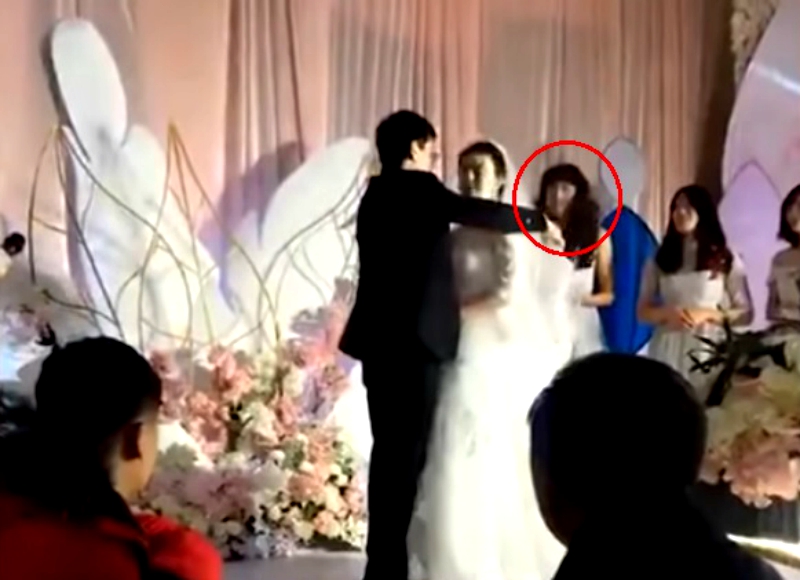 A video of a wedding in northern China showing a man dressed as a bridesmaid has caught the attention of eagle-eyed netizens on social media.