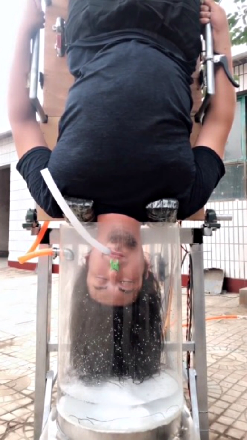 An inventor in China has gone viral on social media after creating a hair washing machine that forces users to go upside down if they actually want to see it work.