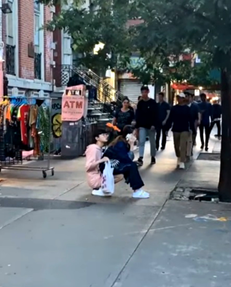A man who turned himself into a chair for his girlfriend to sit on in public has gone viral on social media.
