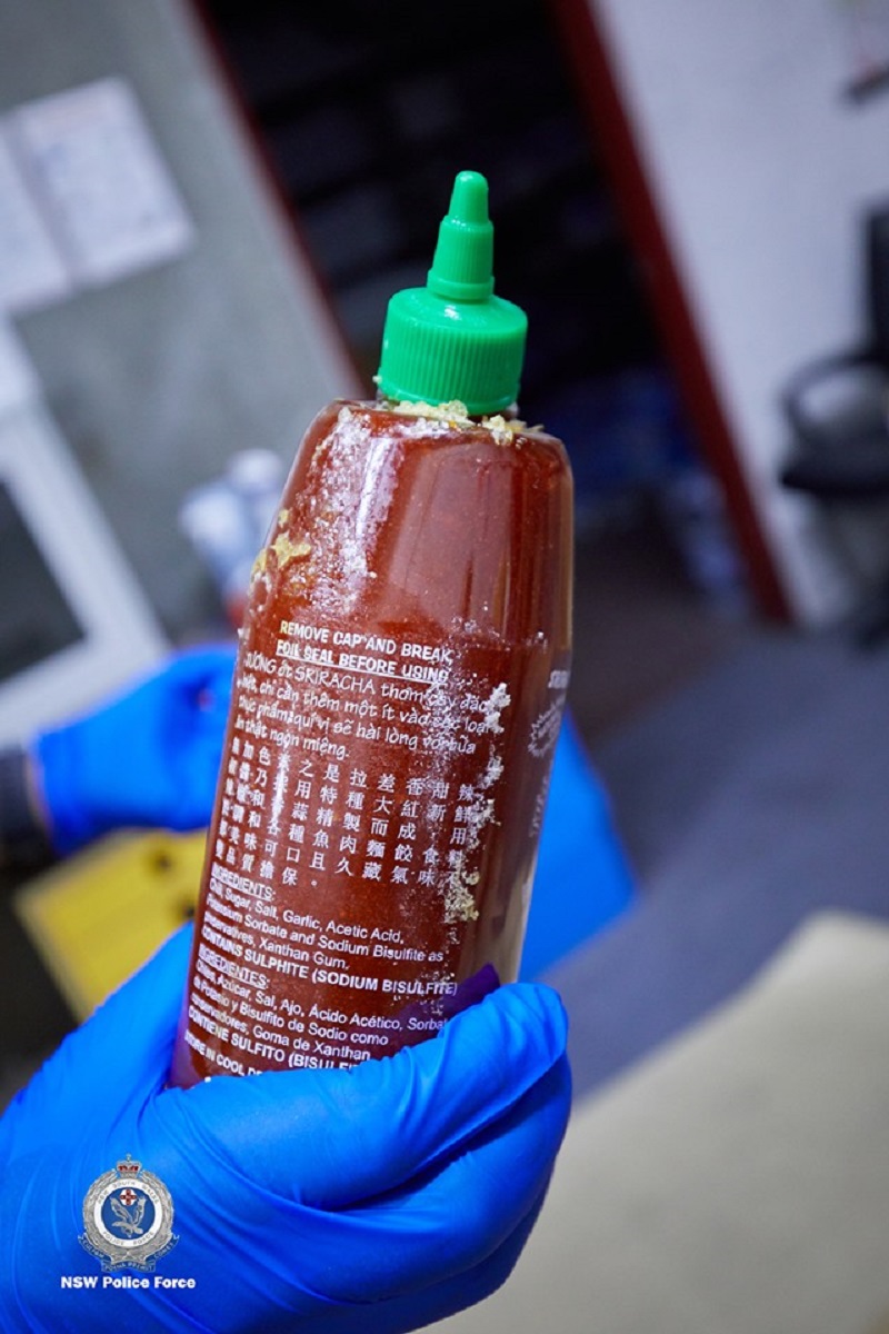 Four Australian men have been arrested for smuggling 400 kilograms (881 pounds) of methylamphetamine inside hundreds of bottles of the popular Asian hot sauce sriracha.