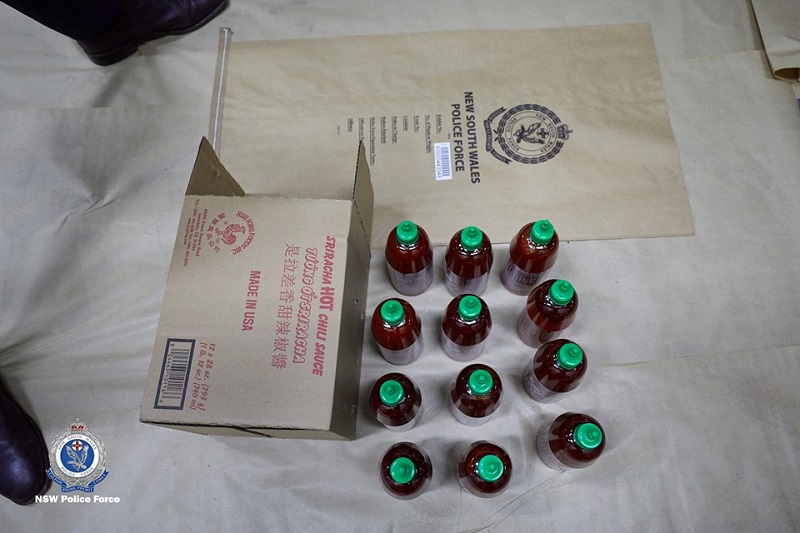 Four Australian men have been arrested for smuggling 400 kilograms (881 pounds) of methylamphetamine inside hundreds of bottles of the popular Asian hot sauce sriracha.