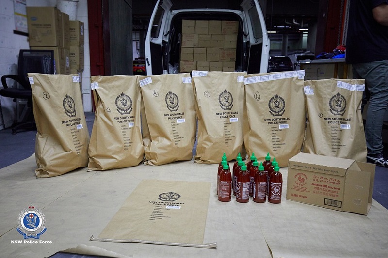 Four Australian men have been arrested for smuggling 400 kilograms (881 pounds) of methylamphetamine inside hundreds of bottles of the popular Asian hot sauce sriracha.