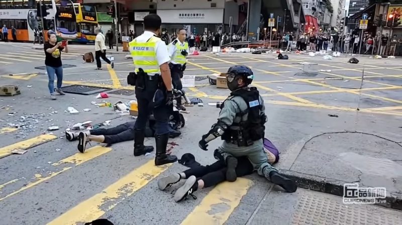 Two protesters have been shot by Hong Kong police during a confrontation in a general strike on Monday.
