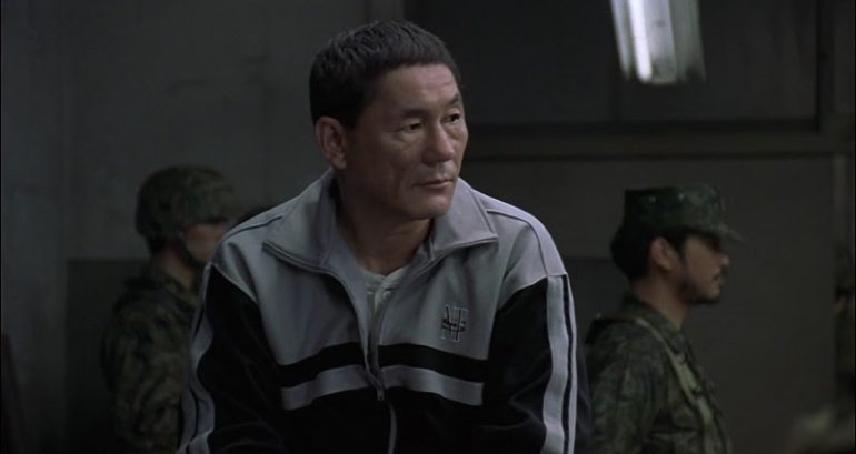 Suspected Yakuza member attacks ‘Battle Royale’ star Beat Takeshi with a pickaxe after begging for a start in showbiz