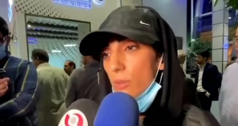 Iranian rock climber gets hero’s welcome after competing at world championship without her hijab