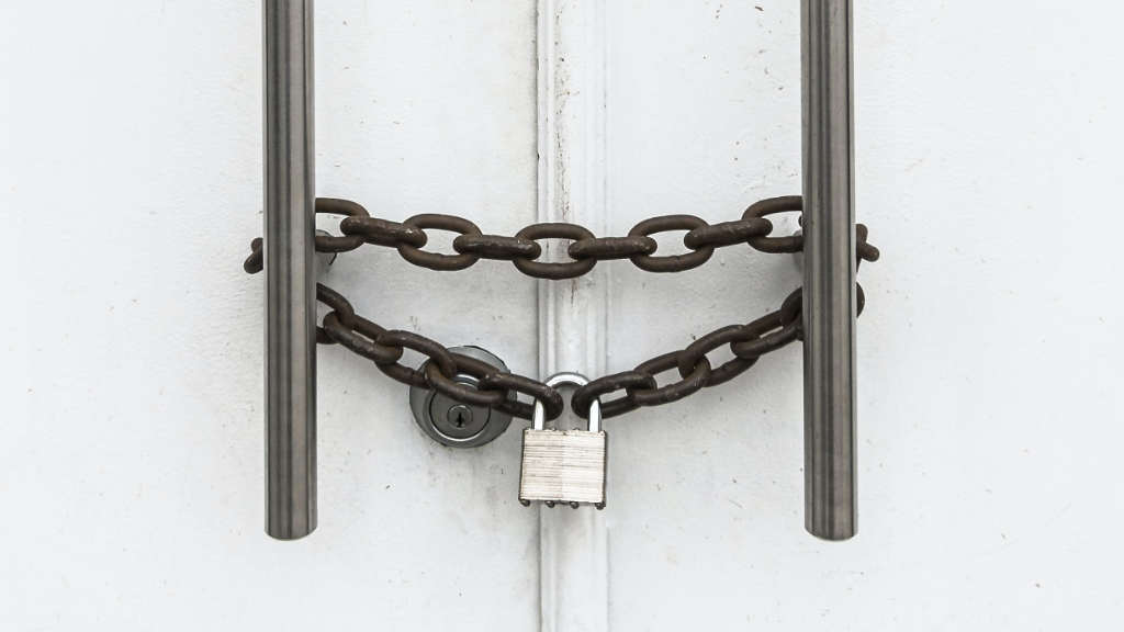 Doors locked with a chain and padlock