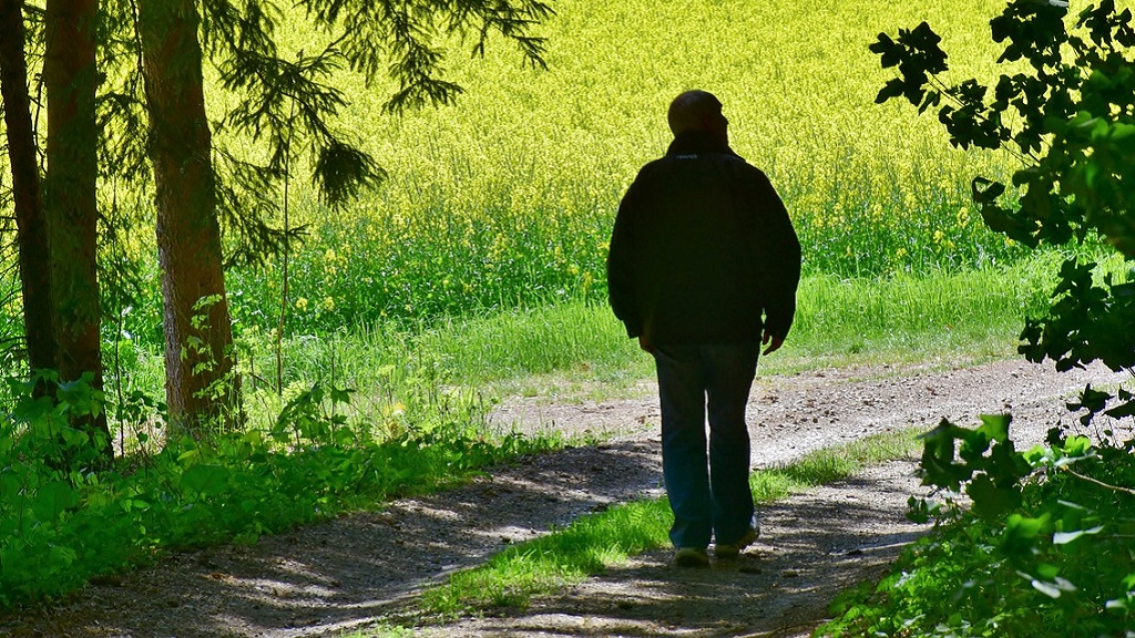 A silhouette of a man walking