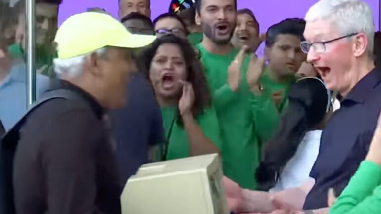 Apple CEO attends first store opening in India, surprised by fan carrying 1984 Mac