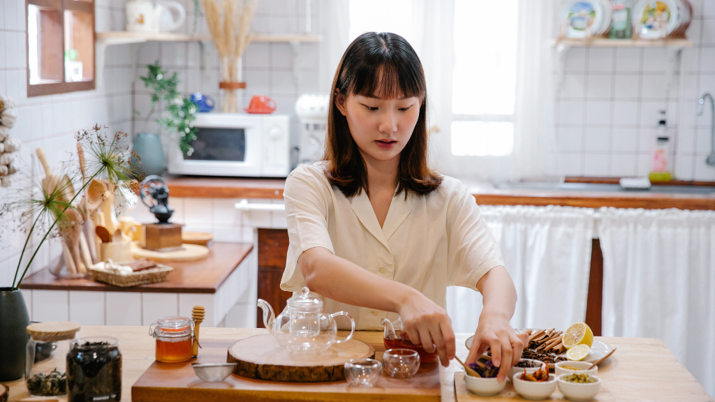 Woman working at kitchen counter