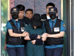 Police escorting Jung Yoo-jung