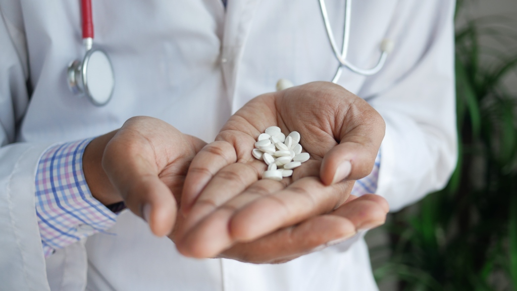 Doctor holding medication