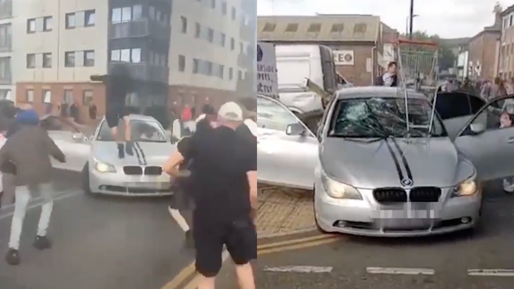 Asian man dragged out of car amid violent UK riots